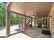 Large covered patio with ceiling fans, brick columns, access to the yard, and bar for entertaining at 330 Noah Pl, Mcdonough, GA 30252