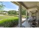 Inviting covered porch with seating, perfect for enjoying the expansive front lawn at 330 Noah Pl, Mcdonough, GA 30252