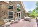Outdoor deck with brick exterior and outdoor dining furniture with ample natural light at 330 Noah Pl, Mcdonough, GA 30252