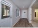 Welcoming foyer features wood-look tile flooring, an exterior door, and a view to the back porch at 330 Noah Pl, Mcdonough, GA 30252