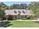 Charming brick home with a meticulously landscaped front yard and inviting column-lined entryway at 330 Noah Pl, Mcdonough, GA 30252