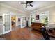Cozy living room offering a view of the yard, hardwood floors, and an inviting ambiance at 330 Noah Pl, Mcdonough, GA 30252