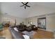 Spacious living room with vaulted ceiling, hardwood floors, fireplace, and view of dining room at 330 Noah Pl, Mcdonough, GA 30252