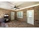 Enclosed porch featuring brick walls, tile floors, and white doors and windows for natural light at 330 Noah Pl, Mcdonough, GA 30252