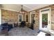 Relaxing screened-in porch with comfortable seating, a ceiling fan, and ample natural light at 330 Noah Pl, Mcdonough, GA 30252