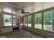 Screened-in porch with views of the yard and forest beyond from the oversized windows at 330 Noah Pl, Mcdonough, GA 30252