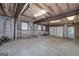 Spacious unfinished basement with garage door and natural light at 330 Noah Pl, Mcdonough, GA 30252
