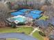 Aerial view of the community pool, tennis courts, and clubhouse at 5114 Verbena Nw Dr, Acworth, GA 30102