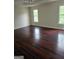Spacious bedroom with hardwood floors, neutral walls, and natural light at 5114 Verbena Nw Dr, Acworth, GA 30102