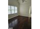 Bright bedroom with hardwood floors, vaulted ceiling, and natural light from windows at 5114 Verbena Nw Dr, Acworth, GA 30102