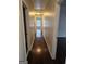 Hallway with hardwood floors connecting to various rooms at 5114 Verbena Nw Dr, Acworth, GA 30102
