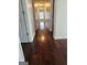 Hallway with hardwood floors connecting rooms and multiple doorways at 5114 Verbena Nw Dr, Acworth, GA 30102