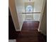 Landing area with hardwood floors and a large window at 5114 Verbena Nw Dr, Acworth, GA 30102