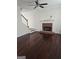 Spacious living room with a fireplace, hardwood floors, and staircase access at 5114 Verbena Nw Dr, Acworth, GA 30102
