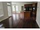 View of the living space featuring hardwood floors, kitchen, breakfast area, and exterior access at 5114 Verbena Nw Dr, Acworth, GA 30102