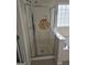 Detail of tiled shower with a bird and flower accent at 5114 Verbena Nw Dr, Acworth, GA 30102
