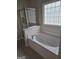 Bright bathroom with tub and shower at 5114 Verbena Nw Dr, Acworth, GA 30102