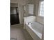 Bright bathroom with tub and shower at 5114 Verbena Nw Dr, Acworth, GA 30102