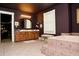 Spacious bathroom with a deep soaking tub, tile floor, double vanity, and natural light through a window for relaxation at 301 Spruill Bridge Rd, Temple, GA 30179