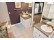 Bathroom featuring dual sinks, a shower, and a large mirror, providing a convenient and functional space at 301 Spruill Bridge Rd, Temple, GA 30179