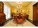 Dining room with a chandelier, large window, hardwood floors and an area rug at 301 Spruill Bridge Rd, Temple, GA 30179