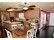 Spacious kitchen featuring wood cabinets, stainless steel appliances, and granite countertops at 301 Spruill Bridge Rd, Temple, GA 30179