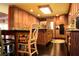 Spacious kitchen featuring wood cabinets, a center island, and stainless steel appliances at 301 Spruill Bridge Rd, Temple, GA 30179