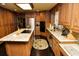 Spacious kitchen with custom cabinets, granite countertops, and stainless steel appliances at 301 Spruill Bridge Rd, Temple, GA 30179