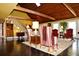 Bright living room featuring a vaulted wood ceiling, dark wood floors, and a staircase at 301 Spruill Bridge Rd, Temple, GA 30179