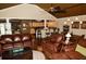 Cozy living room with hardwood floors, comfortable seating, and an open layout to the kitchen at 301 Spruill Bridge Rd, Temple, GA 30179
