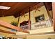 Loft area showing a vaulted ceiling with wooden beams and trim, and a decorative painting at 301 Spruill Bridge Rd, Temple, GA 30179