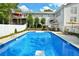 Backyard swimming pool with diving board and an outdoor patio for entertaining and relaxation at 301 Spruill Bridge Rd, Temple, GA 30179