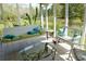 Cozy screened porch offers a relaxing swing and picturesque views of the surrounding landscape at 301 Spruill Bridge Rd, Temple, GA 30179