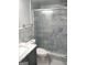 Modern bathroom with blue tile shower and marbled vanity at 1025 Lynwood Pl, Forest Park, GA 30297