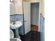Bathroom featuring dark tile floors and a standing sink at 1025 Lynwood Pl, Forest Park, GA 30297