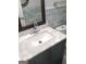 Bathroom features marble countertop, vanity with storage, and modern fixtures at 1025 Lynwood Pl, Forest Park, GA 30297