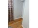 View of a walk-in closet with hardwood flooring and decorative curtains at 1025 Lynwood Pl, Forest Park, GA 30297