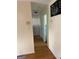 A hallway featuring hardwood floors and neutral colored walls at 1025 Lynwood Pl, Forest Park, GA 30297