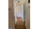 Hallway featuring hardwood floors and access to multiple rooms at 1025 Lynwood Pl, Forest Park, GA 30297