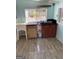 Functional kitchen with a utility sink featuring tile flooring, cooktop, and propane tank at 1025 Lynwood Pl, Forest Park, GA 30297