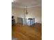 Open living area featuring hardwood floors and an ornate chandelier at 1025 Lynwood Pl, Forest Park, GA 30297
