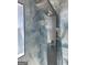 Modern shower featuring adjustable shower head and luxurious blue tiled walls at 1025 Lynwood Pl, Forest Park, GA 30297