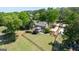 Beautifully landscaped property features a large backyard with lake views, perfect for outdoor activities at 513 Viridian Vw, Peachtree City, GA 30269