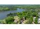 Stunning aerial view of the property showcasing its prime lakeside location and lush, green surroundings at 513 Viridian Vw, Peachtree City, GA 30269