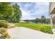 Large backyard with lush green grass and a view of the lake, perfect for outdoor activities at 513 Viridian Vw, Peachtree City, GA 30269