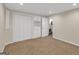 A bedroom featuring carpet flooring and access to a closet, a storage room, and other rooms at 513 Viridian Vw, Peachtree City, GA 30269
