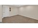 Neutral bedroom featuring plush carpeting, a blank canvas, and a door to another room at 513 Viridian Vw, Peachtree City, GA 30269