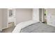 Bedroom with carpeted floors, adjacent bathroom, and view into the hallway at 513 Viridian Vw, Peachtree City, GA 30269