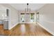 Bright dining area with hardwood floors, modern lighting, and convenient access to the kitchen at 513 Viridian Vw, Peachtree City, GA 30269