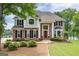 Beautiful two-story brick home with well-maintained lawn and landscaping at 513 Viridian Vw, Peachtree City, GA 30269